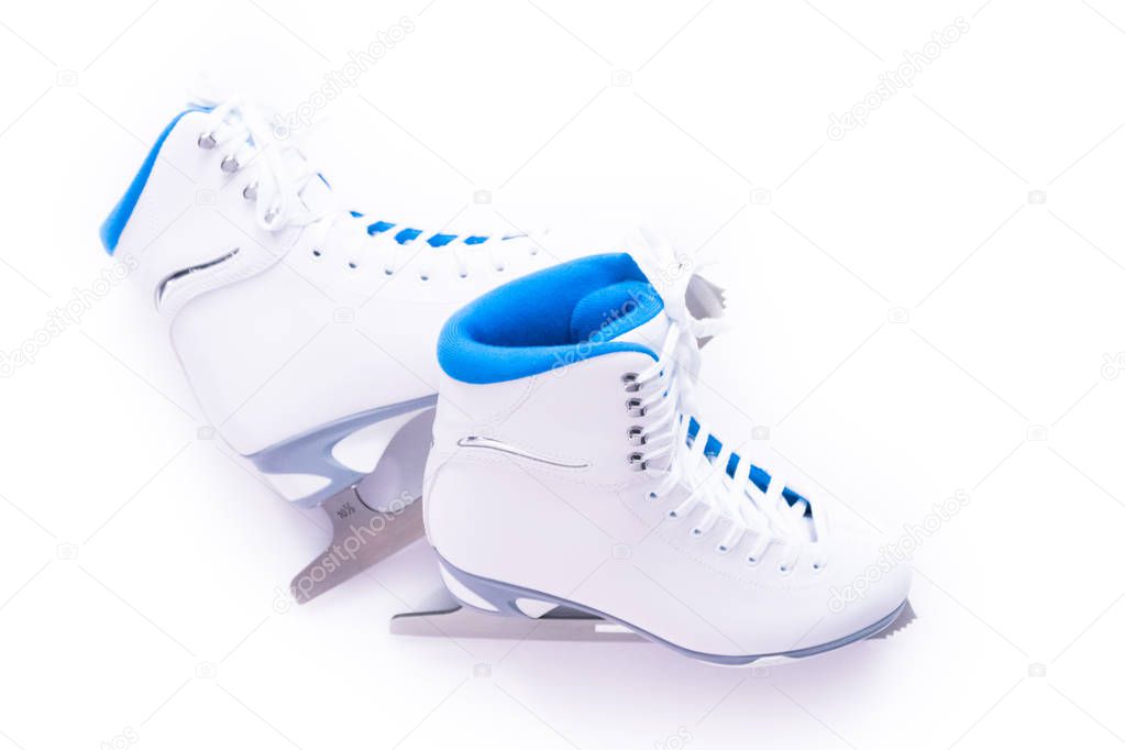 Flat lay. New white figure skates on a white background.