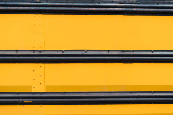 Close ups of yellow school bus on field trip.