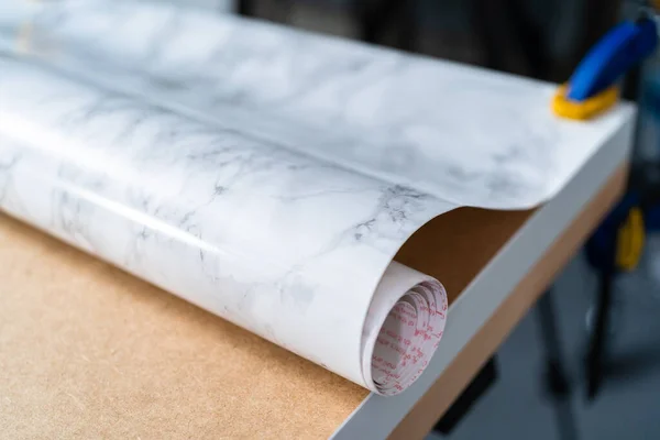 Making marble board with adhesive paper for food photography.