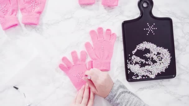 Flat Lay Rhinestone Pink Kids Gloves Snowflake Shapes — Stock Video