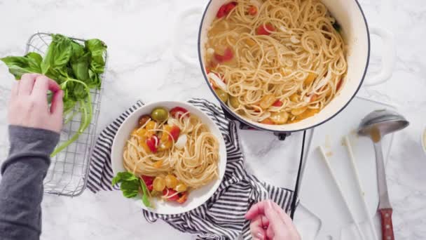 Making Vegetarian Pasta Cherry Tomatoes Fresh Basil White Plate — Stock Video