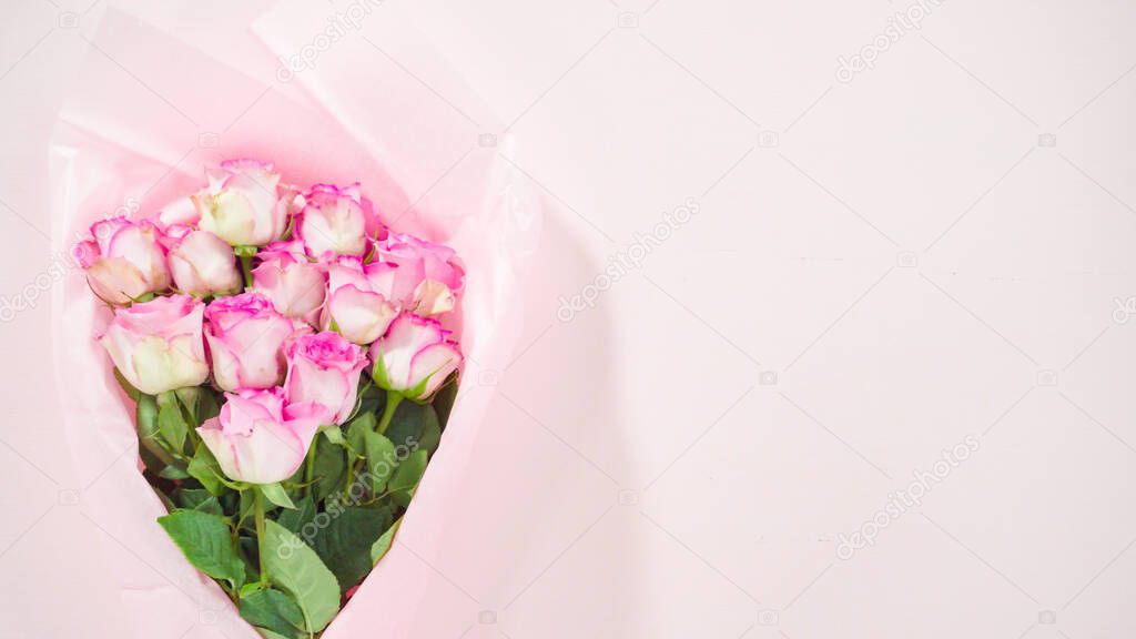 Flat lay. Step by step. Bouquet of pink roses on a pink background.