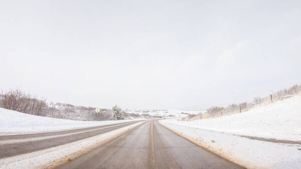Driving on typical paved rural roads in suburban America.