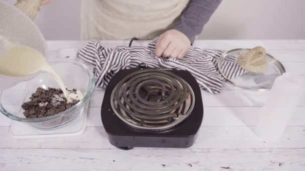 Preparing Homemade Chocolate Ganache Chocolate Raspberry Cupcakes — Stock Video