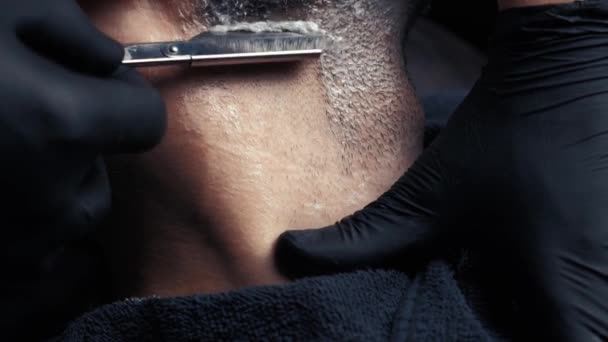 Barber shaving with a danger razor Stock Footage