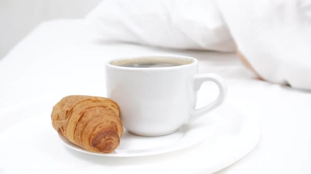 Concept female sleeping on the bed and white cup of coffee. white background — Stock Video