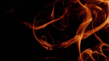 Kırmızı siyah arka plan üzerine duman hareketi.