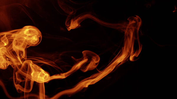 Movement of red smoke on black background. fire design