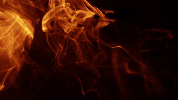 Movement of red smoke on black background. fire design