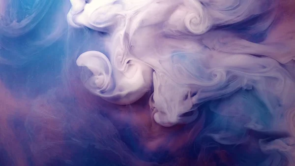 Blue pink clouds of ink in liquid. black background — Stock Photo, Image