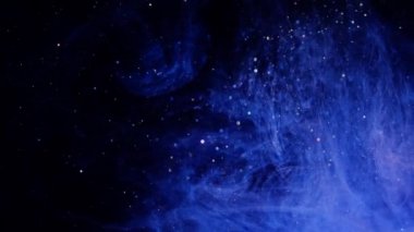 Işıltılı mavi parçacık arka plan. Evren mavi toz siyah arka plan üzerinde yıldız ile. Parçacıkların hareket soyut.