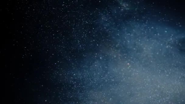 Glitzernden blauen Partikelhintergrund. Universum blauer Staub mit Sternen auf schwarzem Hintergrund. Bewegungsabstrakt von Teilchen. — Stockvideo