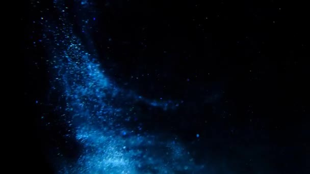 Blue glitter on a black background. — Stock Video