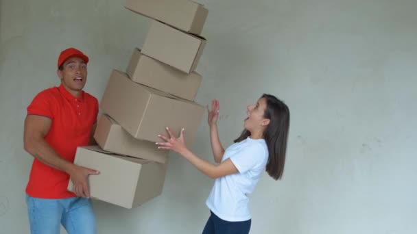 Delivery Man With Falling Stack Of Boxes. concept for delivery insurant. — Stock Video
