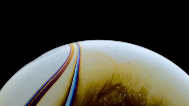 Virtual reality space with abstract multicolor psychedelic planet. Closeup Soap bubble like an alien planet on black background. — Stock Video