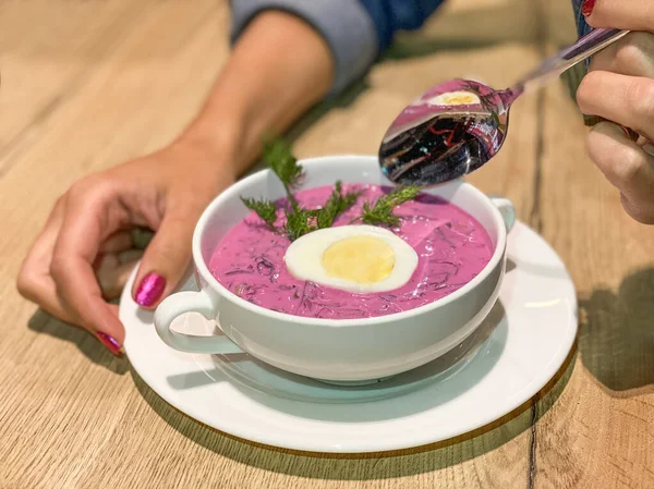 Girl eating cold beetroot soup. Closeup — Stock Image Girl Eating Cold Beetroot Soup Closeup Stock Picture