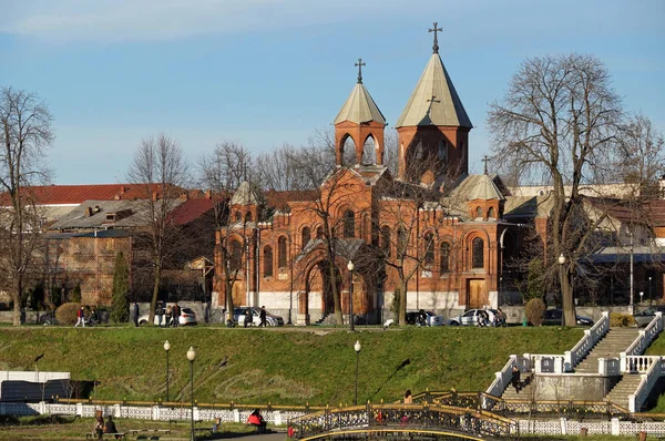 View across the Terek river on its right bank with Armenian Christian Temple Of St. Gregory The Illuminator on it in Vladikavkaz city. The building was erected in 1868. Vladikavkaz, North Ossetia - — Stock Photo, Image