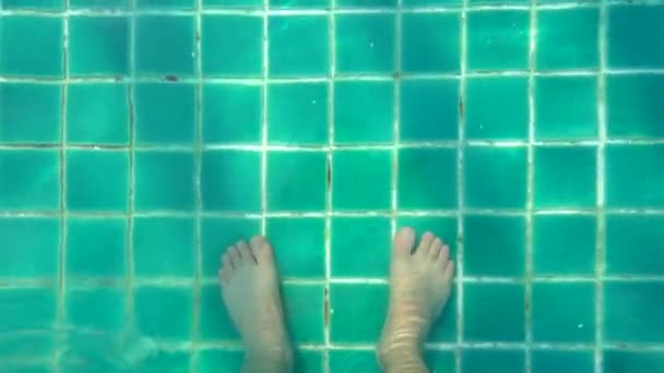 Top view human legs walking in swimming pool — Stock Video
