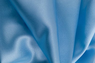 İpek lüks arka plan, bez, ışık mavi bez doku parçası.