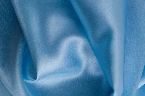 İpek lüks arka plan, bez, ışık mavi bez doku parçası.