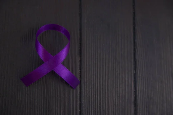 Purple ribbon symbol of pancreatic or leiomyosarcoma , cancer awareness month