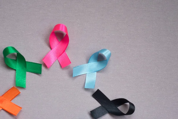 Different ribbons, symbols of cancer, cancer awareness month.  Copy space for your text.