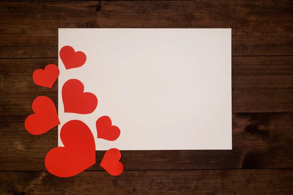 Red hearts on wooden table for banner background, copy space, background for love card
