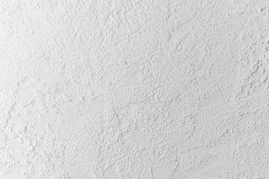 Sert beyaz duvar dokusu benzersiz yüzey ayrıntılarını ve kalıplarını gösterir.