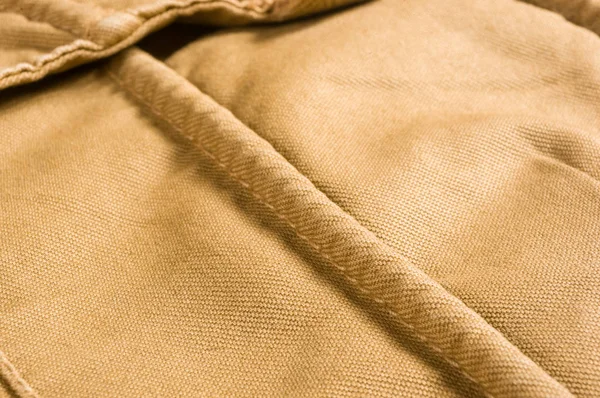 clothing items washed cotton fabric texture with seams, macro, close-up