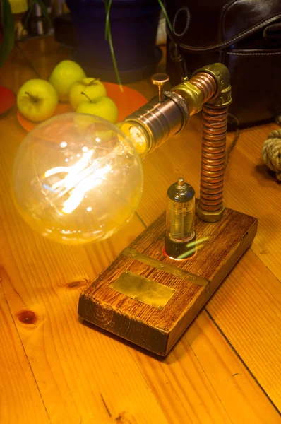 Light fixture handmade in vintage style, wooden case and radio tube, copper finish, led lamp