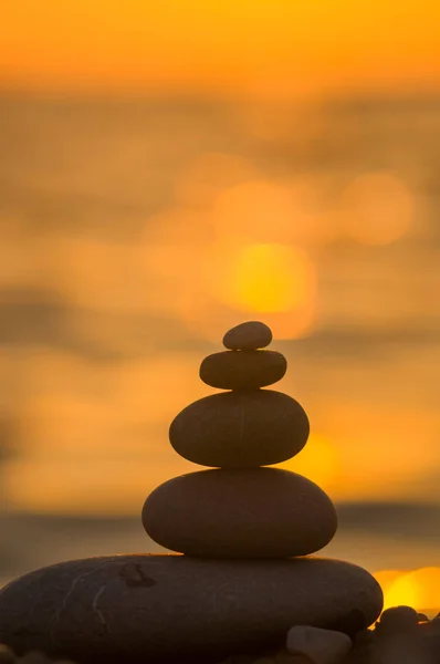 stack of zen stones on pebble beach