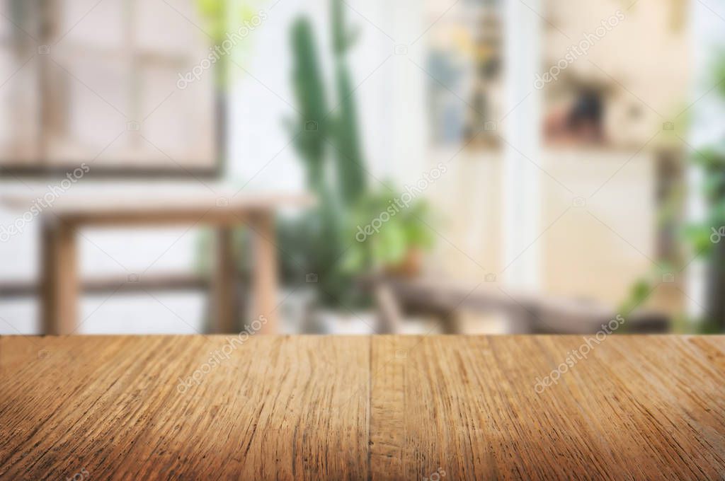 empty wooden table with blur restaurant background.