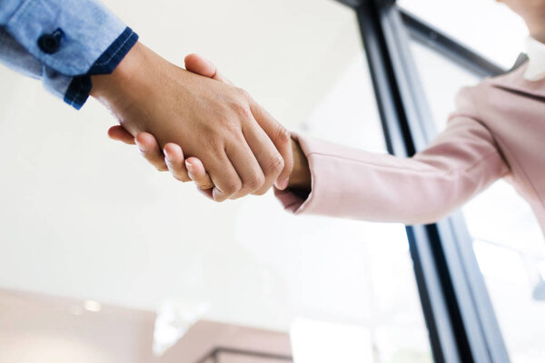 business partner hands shaking about agreement license