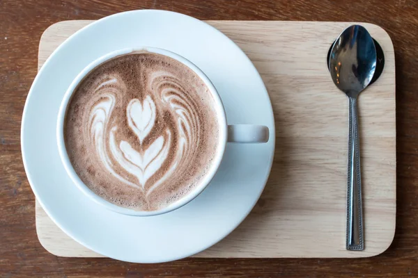 Closeup Shot Cup Hot Chocolate Latte Art Surface Serving Wooden — Stock Photo, Image