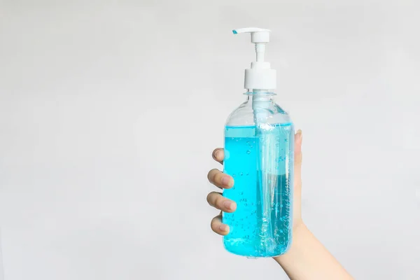 Someone hand holding a hand sanitizer on isolated background. Hand sanitizer is Instant gel contains at least 60 % alcohol used to decrease infectious or kills germs, bacteria even more coronavirus.