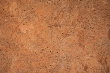 Toprak duvar yapısının tam kare görüntüsü. Bu duvarlar, çakıl, kum, alüvyon ve az miktarda kil içeren kütlelerin bir karışımına çarparak inşa edilmiştir..