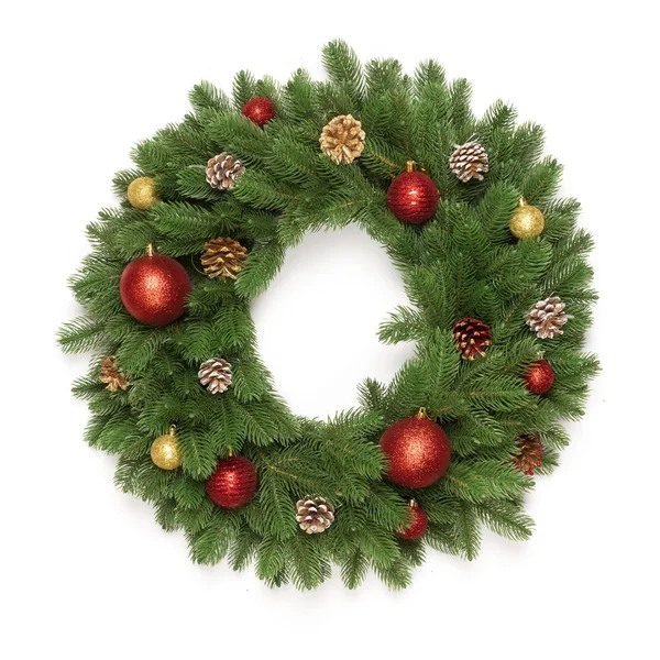 Christmas tree branches in a circle frame isolated on white background with copy space for text. Round wreath fir with Christmas toy balls and fir cones. Flat lay — Stock Photo, Image