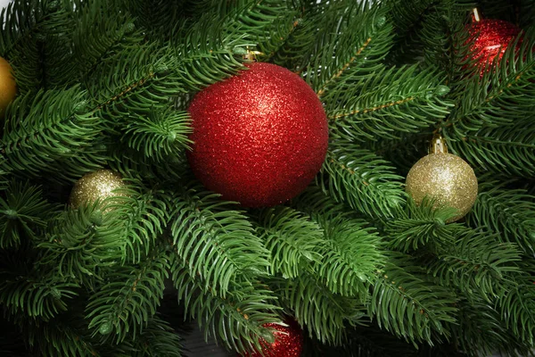 Christmas tree branches  background. Fir with new year toy balls and fir cones — Stock Photo, Image