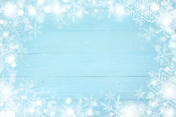Cornice di Natale di fiocco di neve con spazio copia, su sfondo di legno bordo blu. Vista dall'alto — Foto Stock