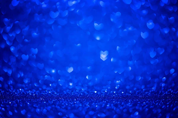 Bleu Bokeh forme Coeurs amour jour Arrière-plan avec des paillettes bleu vif Lumières pour la Saint-Valentin, 8 Mars ou Journée des femmes. Plan studio — Photo