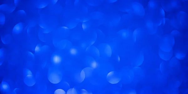 Bokeh bleu forme ronde Fête des mères Fond avec des paillettes bleu vif Lumières pour la Saint-Valentin, 8 mars ou journée des femmes. Plan studio — Photo