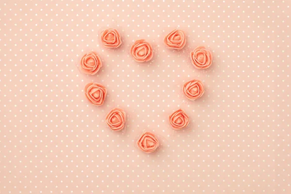 Layout coral floral composition top view on living coral background. Flowers concept rose coral shape heart flat lay. 8 March Womens day. Mothers day pattern