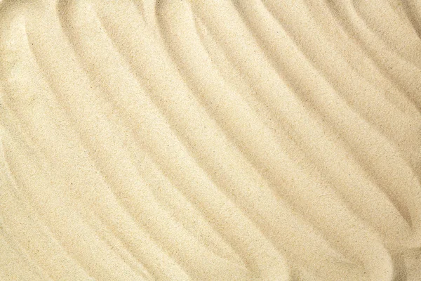 Textura ondulada de arena. Fondo de playa de arena para su diseño. Fondo de verano. Acostado. Vista superior — Foto de Stock