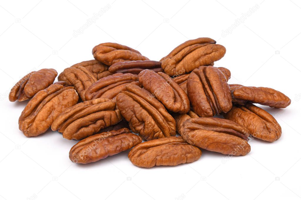 Pile Pecan nuts isolated on white background. Heap shelled Pecans nut closeup. Tasty raw organic food and healthy snack