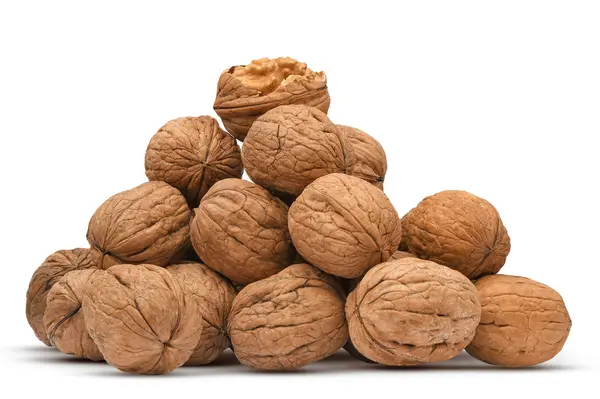 Walnuts heap isolated on white background. Pile nuts closeup for your design. Nuts collection — Stock Photo, Image