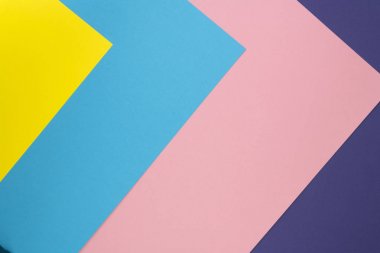 Pastel renkli kağıt dokusu. Düz yaratıcı geometrik arka plan yatıyordu. Düz yatıyordu