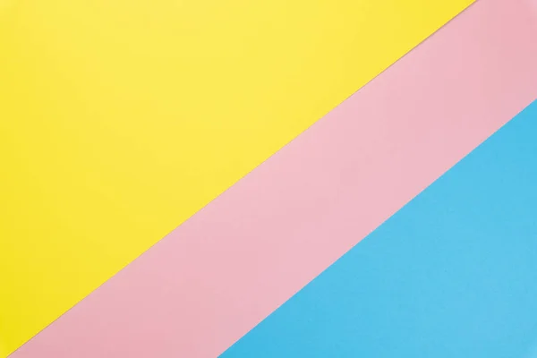 Kék és rózsaszín, sárga pasztell színű papírlakás feküdt háttér. Felülnézet — Stock Fotó