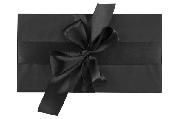 Geschenkbox isoliert auf weißem Hintergrund. Schwarzer Geschenkkarton für Neujahr oder Verkauf am Schwarzen Freitag lizenzfreie Stockbilder