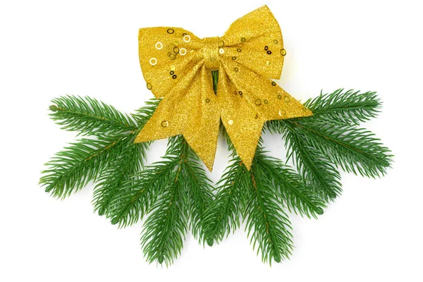 Christmas ornament gold bow and pine branch isolated on white background — Stock Photo, Image