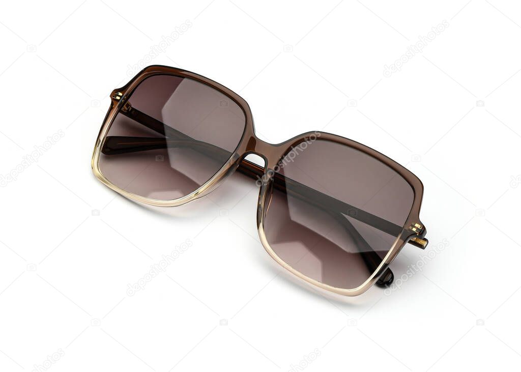 Sunglasses isolated on white background. Sun glasses summer woman accessories brown color. Top view